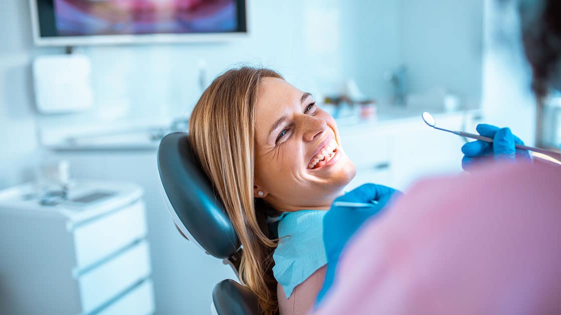 lady in dental chair smiling